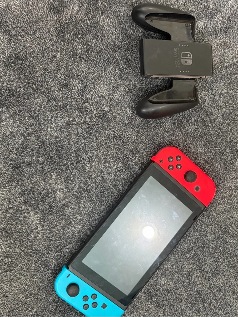 Nintendo Switch with Red & Blue Joy-Con Controllers + hand held controller